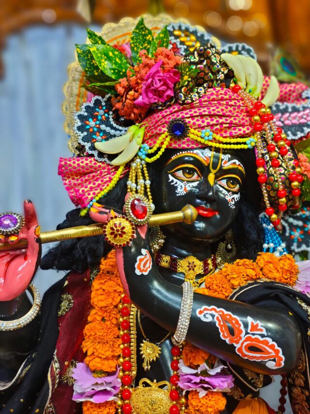 A colorful figurine of a Hindu deity adorned with flowers and ornaments in Rangpur, Bangladesh.